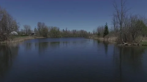4k aerial low flight over water in country Stock Footage 63065229