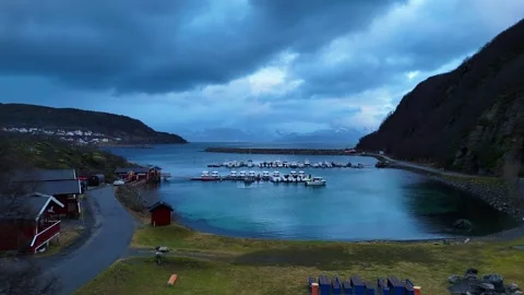 4K Aerial: Low flight path directly over a remote arctic marina and boats Vídeo Stock 337019174