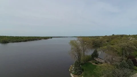 4K Aerial Low Pass Over Tree and Water Wonder Lake Illinois Video stock 75708381