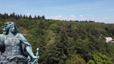 4K Aerial Magic: Statue on Hill in Idyllic River Valley Stock Footage 239053136