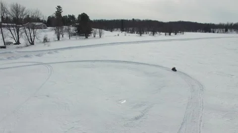 4k aerial mini snowmobile gets stuck in snow Stock Footage 61146463