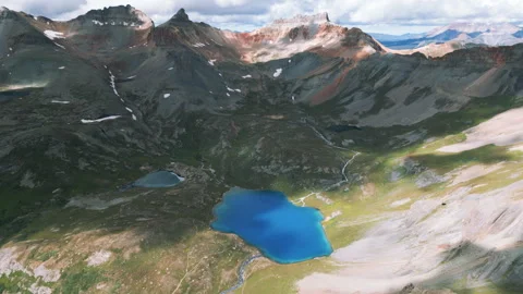 4K Aerial Mountain Peak Summit Blue Lake Fly Over Hiking Clear Lake Stock Footage 300055869