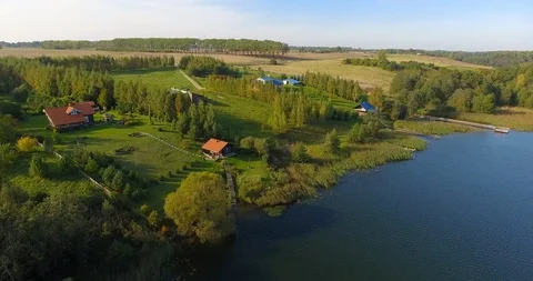 4K Aerial nature landscape fields lakes forests houses cottages 動画素材 106554815