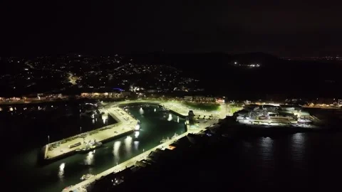 4K aerial night view of Howth Harbour in Dublin Bay Ireland 動画素材 332737144