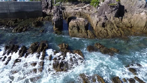 4K aerial ocean view with drone flyover rocky coastline Stock Footage 257792005