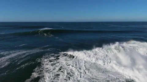 4K Aerial Ocean Wave Breaking Near Coastal Shoreline Stock Footage 333704029