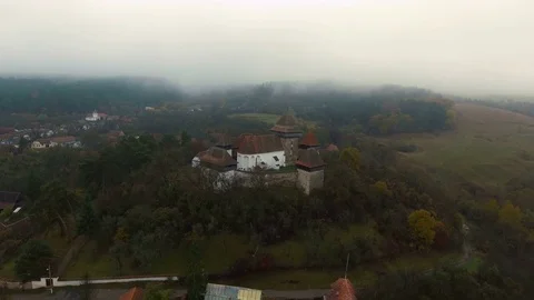 4k aerial orbit flight around medieval church in Viscri. Stock Footage 78225514