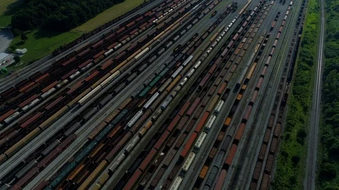4k aerial orbiting shot of a rail yard | Stock Video | Pond5
