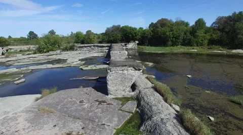 4k aerial over broken train bridge and streams Stock Footage 55607251