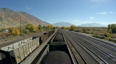 4K Aerial over moving train pulling coal Video stock 42945768