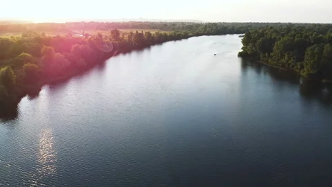 4K Aerial. Over river in evening time with beautiful sunlight. Landscape Stock Footage 155803558