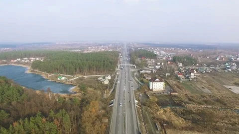  4K Aerial. Over suburb equal highway with cars  스톡 동영상 73487004