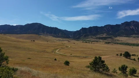 4k Aerial over winding path into Colorado mountains Stock Footage 123134969