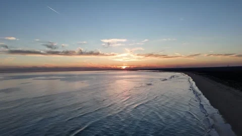 4K Aerial: Pan left and tilt down over pine forest and beach in Huelva Spain Stock Footage 333637647