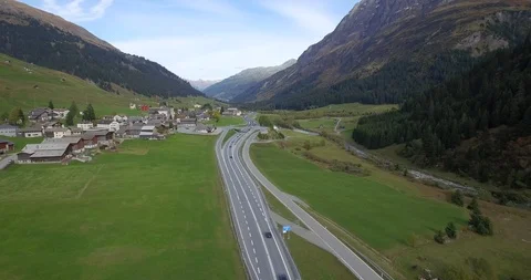 4k aerial pan view flight over highway near mountain area in countryside  Stock Footage 93373821