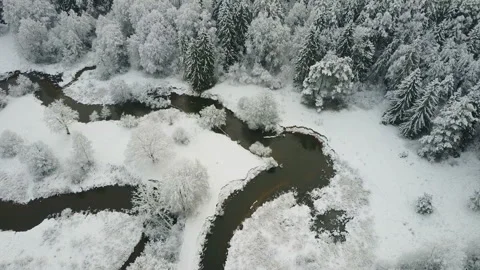4K. Aerial panoramic view of wild winding river in winter frozen forest. Video stock 97965149