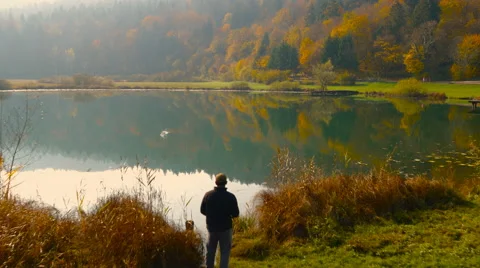 4K Aerial: Passing Above Casting Fishing Line into Lake Landscape Vídeo Stock 56937952