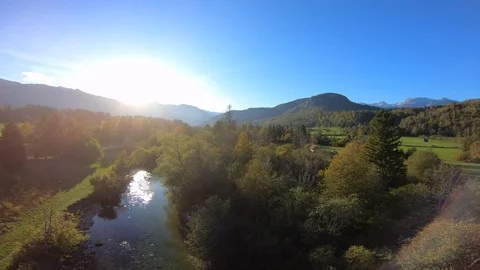 4K AERIAL Pristine river running through the lush green sunny mountain valley Stock Footage 117927488