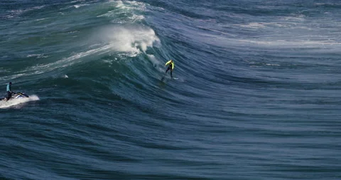 4K aerial of pro surfer David Langer skilfully riding waves of Atlantic ocean Stock Footage 163079697