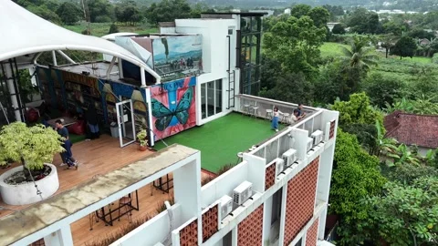 4K Aerial Pull Back of Family Gathering on Hotel Rooftop in Sentul, Bogor, West  Stock Footage 328224729