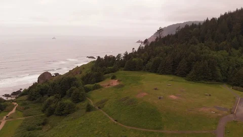 4K Aerial Push Over Cliff Towards Terrible Tilly Lighthouse in Distant Fog Video stock 111118400