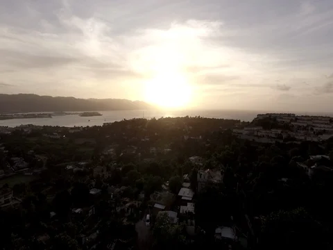 4k Aerial Pushing Into Sunset Over the Hills in Jamaica- RAW Color Stock Footage 70164253