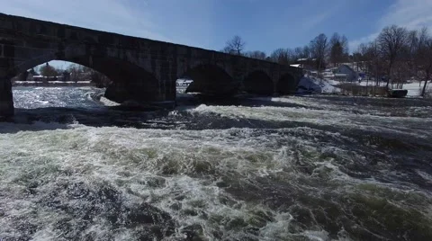 4k aerial rapids pass under bridge low angle Stock Footage 62941289