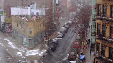 4k Aerial rising pull back from a snowy Williamsburg corner to a tree lined Stock Footage 342118192
