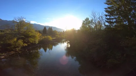 4K AERIAL Setting sun reflecting on the mountain river surface Stock Footage 118011797