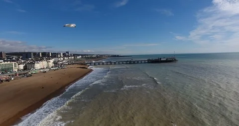 4k Aerial shot of Brighton UK New Pier and sea front during a sunny day Stock Footage