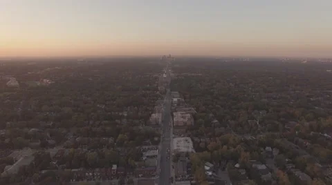 4k Aerial shot camera moving backward overlooking North York center in sunset Stock Footage 61137864