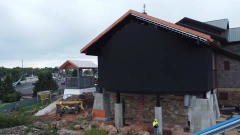 4k Aerial Shot of the Construction of a Large Video Screen at Bass Pro Shops Видео 213601470