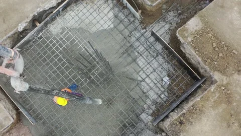 4K Aerial shot construction worker pouring concrete at construction site basis Stock Footage 162959278