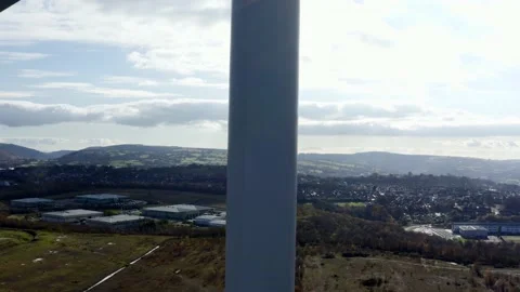 4K Aerial shot of large wind turbine up close climbing altitude from botom Stock Footage 142612982