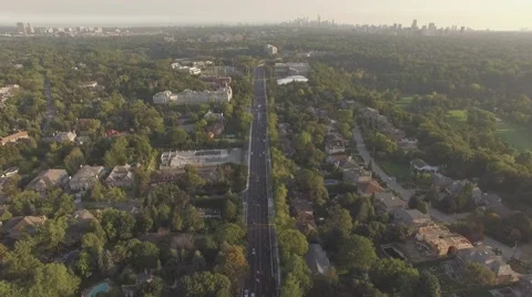 4k Aerial shot overlooking downtown Toronto camera pan down in a sunny day Stock Footage