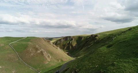4K Aerial Shot Passing Over Fresh Green British Mountains and Land in Summer Stock Footage 94978051