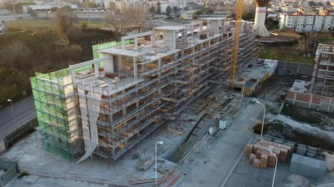 4K Aerial side view of big construction site at sunset Stock Footage 122693435