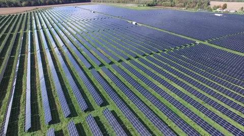 4k aerial solar farm wide angle slow spin Stock Footage