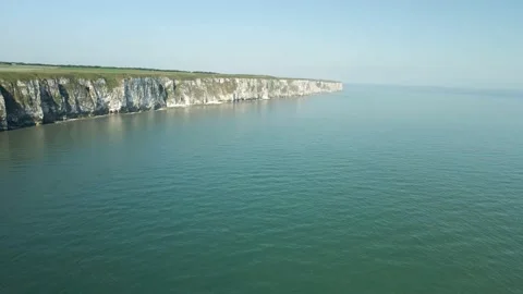 4K aerial static shot of white chalk cliffs and blue ocean Stock Footage 200023127