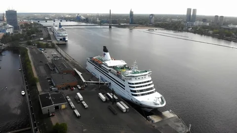 4k aerial static view Daugava river, cruise ship Talink, architecture of Riga in Stock Footage 112869545