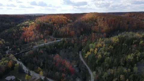 4K aerial straight up while looking at train going across Forks of the Credit hi Video stock 150129896