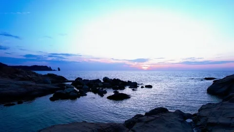 4K Aerial Sunset drone view between Rpcks on Giglio Island Italy Stock Footage 244538579