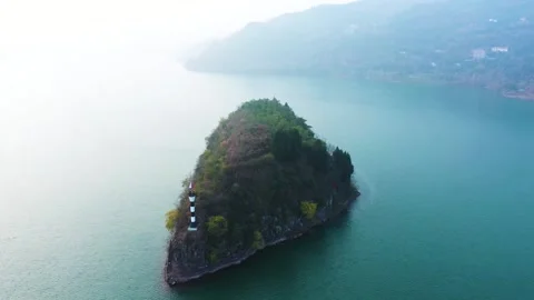 4K Aerial Sunset Light on River Islet Navigation Lighthouse Stock Footage 321040704