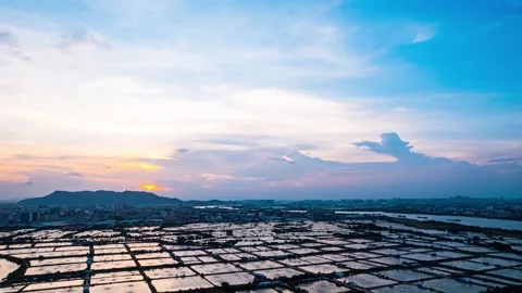 4K Aerial Time-lapse of Sunset Glow Over Rural Farmland and Breeding Fields Video stock 342122361