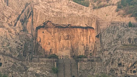 4K Aerial Timelapse of Light and Shadow at Vairocana Buddha Niche Stock Footage 345470554