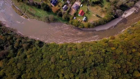 4k aerial: Top down flight over small village in Bieszczady mountains.  Stock Footage 96006748