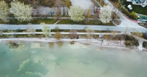 4k aerial top down shot of street and beach in rural town Seebruck am Chiemsee Stock Footage 187466735