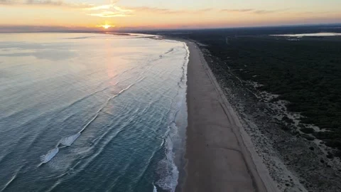 4K Aerial Top-Down: Static shot of waves on Enebrales beach in Huelva Spain. Stock Footage 333637631