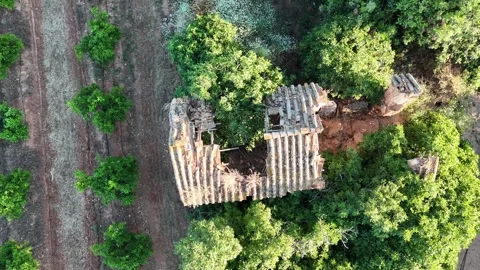 4K Aerial top down view of abandoned ruined stone house in countryside Stock Footage 335956550