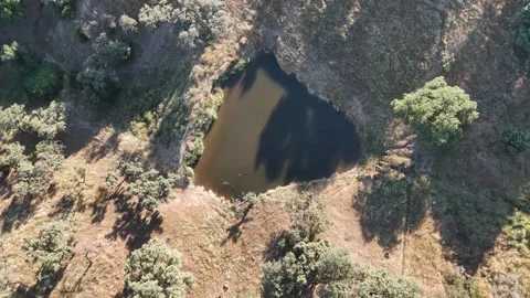 4K Aerial top down view flying forward over a water reservoir with reflection Stock Footage 336019502